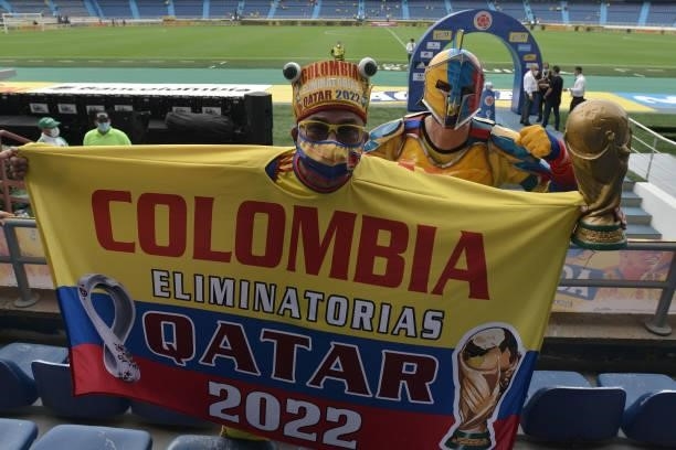 Fan of Colombia shows a flag during a match between Colombia and Argentina as part of South American Qualifiers for Qatar 2022 at Estadio...