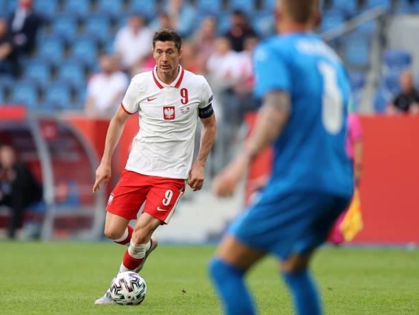 Robert Lewandowski of Poland runs with the ball during the international friendly match between Poland and Iceland at Stadion Poznan on June 08, 2021...