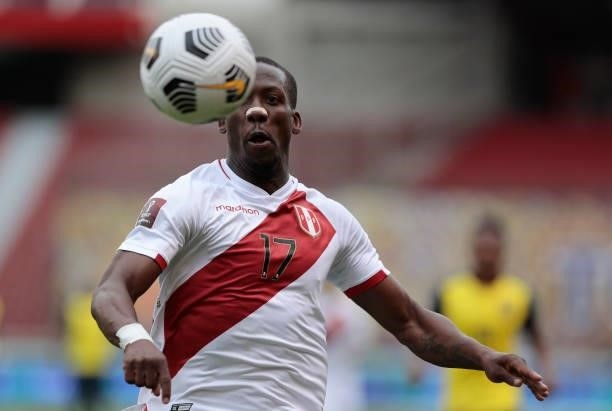 Luis Advíncula of Peru vies for the ball during a match between Ecuador and Peru as part of South American Qualifiers for Qatar 2022 at Rodrigo Paz...