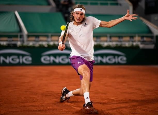 Stefanos Tsitsipas of Greece hits a backhand against Daniil Medvedev of Russia in the quarterfinals of the men's singles at Roland Garros on June 08,...