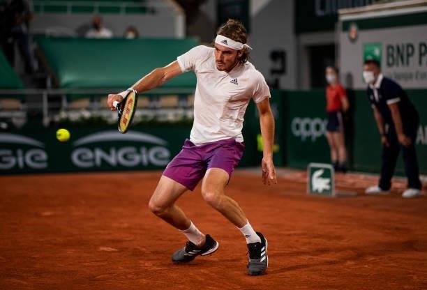 Stefanos Tsitsipas of Greece hits a backhand against Daniil Medvedev of Russia in the quarterfinals of the men's singles at Roland Garros on June 08,...