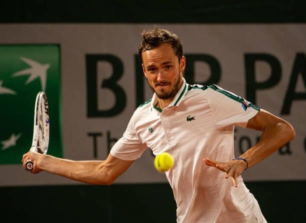Daniil Medvedev of Russia hits a forehand against Stefanos Tsitsipas of Greece in the quarterfinals of the men's singles at Roland Garros on June 08,...
