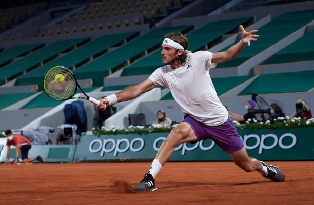 Stefanos Tsitsipas of Greece returns a ball in his Quarter Final match against Daniil Medvedev of Russia during day ten of the 2021 French Open at...
