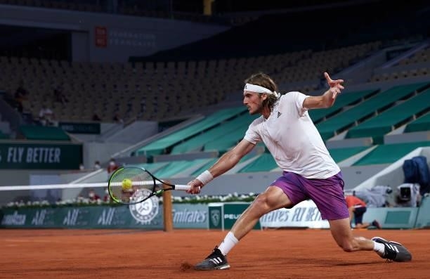 Stefanos Tsitsipas of Greece returns a ball in his Quarter Final match against Daniil Medvedev of Russia during day ten of the 2021 French Open at...