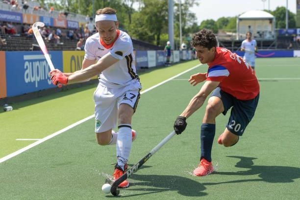 Christopher Ruhr of Germany battles for possession with Eliot Curty of France during the Euro Hockey Championships match between France and Germany...