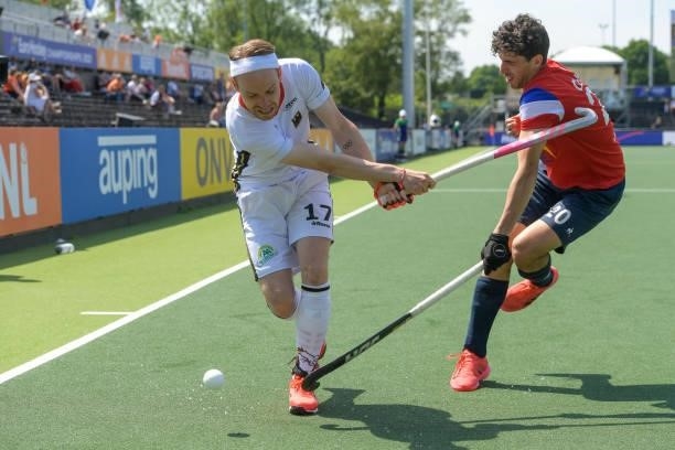 Christopher Ruhr of Germany battles for possession with Eliot Curty of France during the Euro Hockey Championships match between France and Germany...