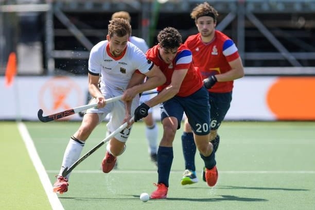 Constantin Staib of Germany battles for possession with Eliot Curty of France during the Euro Hockey Championships match between France and Germany...