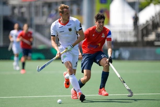 Eliot Curty of France and Niklas Wellen of Germany during the Euro Hockey Championships match between France and Germany at Wagener Stadion on June...