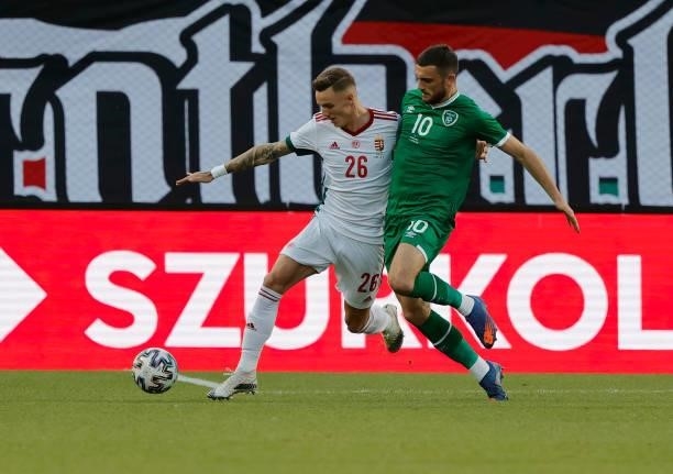 Troy Parrott of Republic of Ireland challenges Bendeguz Bolla of Hungary during the International Friendly match between Hungary and Republic of...