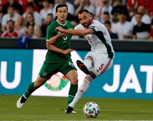 Attila Fiola of Hungary shoots on goal before Josh Cullen of Republic of Ireland during the International Friendly match between Hungary and Republic...