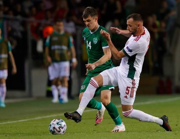 Attila Fiola of Hungary tackles Jason Knight of Republic of Ireland during the International Friendly match between Hungary and Republic of Ireland...