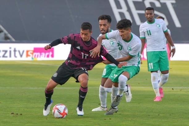 Erick Sanchez of Mexico fights for the ball with Mohamed Hindi of Arabia Saudita during the international friendly match between Mexico U23 and Saudi...