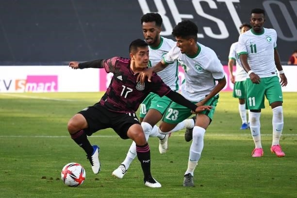 Erik Sanchez of Mexico fights for the ball with Abdulbasit Mohammed of Arabia Saudita during the international friendly match between Mexico U23 and...