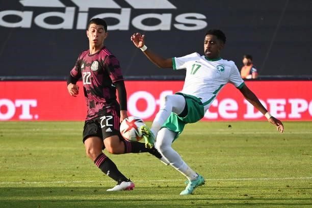 Erik Lira of Mexico fights for the ball with Saad Ali of Arabia Saudita during the international friendly match between Mexico U23 and Saudi Arabia...
