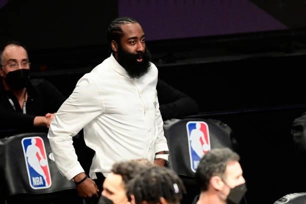 James Harden of the Brooklyn Nets looks on from the sideline against the Milwaukee Bucks in Game Two of the Second Round of the 2021 NBA Playoffs at...
