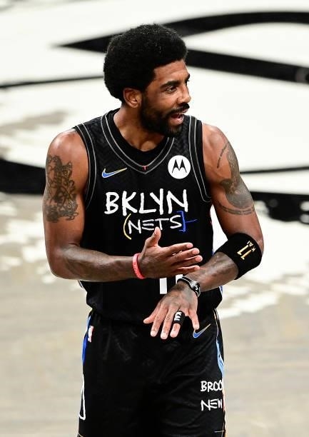 Kyrie Irving of the Brooklyn Nets reacts after being called for a foul against the Milwaukee Bucks in Game Two of the Second Round of the 2021 NBA...