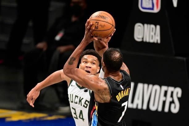 Kevin Durant of the Brooklyn Nets attempts a jump shot against Giannis Antetokounmpo of the Milwaukee Bucks in Game Two of the Second Round of the...