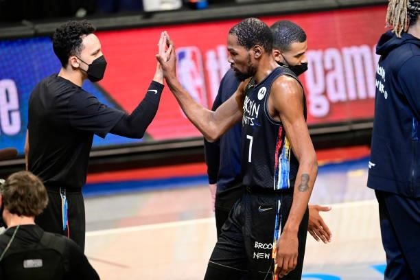 Kevin Durant of the Brooklyn Nets congratulated by Landry Shamet after scoring a basket in Game Two of the Second Round of the 2021 NBA Playoffs at...