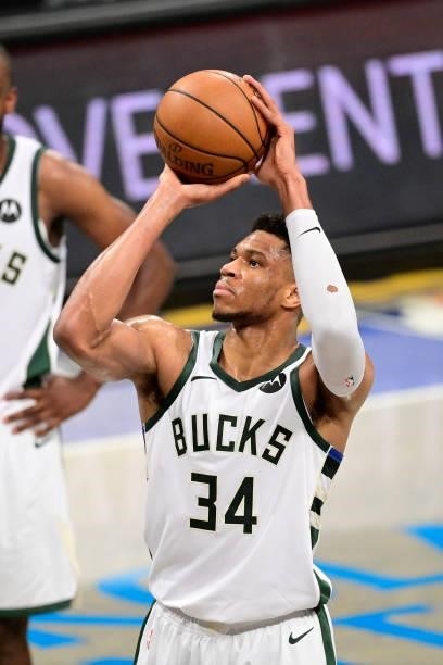 Giannis Antetokounmpo of the Milwaukee Bucks attempts a free throw against the Brooklyn Nets in Game Two of the Second Round of the 2021 NBA Playoffs...