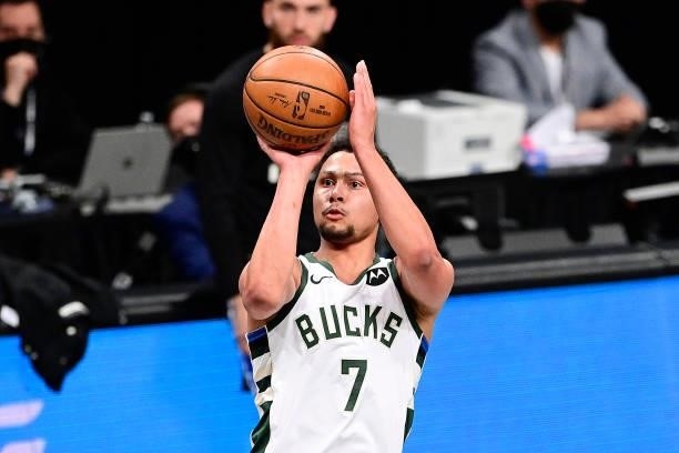 Bryn Forbes of the Milwaukee Bucks attempts a jump shot against the Brooklyn Nets in Game Two of the Second Round of the 2021 NBA Playoffs at...