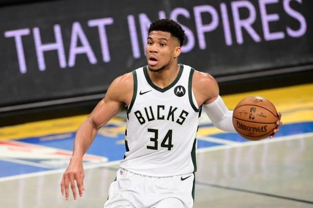 Giannis Antetokounmpo of the Milwaukee Bucks handles the ball against the Brooklyn Nets in Game Two of the Second Round of the 2021 NBA Playoffs at...