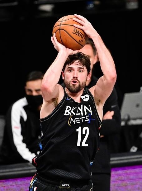 Joe Harris of the Brooklyn Nets attempts a jump shot against the Milwaukee Bucks in Game Two of the Second Round of the 2021 NBA Playoffs at Barclays...