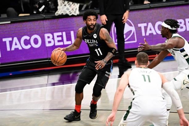 Kyrie Irving of the Brooklyn Nets drives to the basket against the Milwaukee Bucks in Game Two of the Second Round of the 2021 NBA Playoffs at...