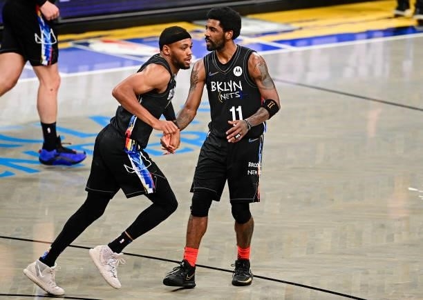 Bruce Brown and Kyrie Irving of the Brooklyn Nets celebrate against the Milwaukee Bucks in Game Two of the Second Round of the 2021 NBA Playoffs at...