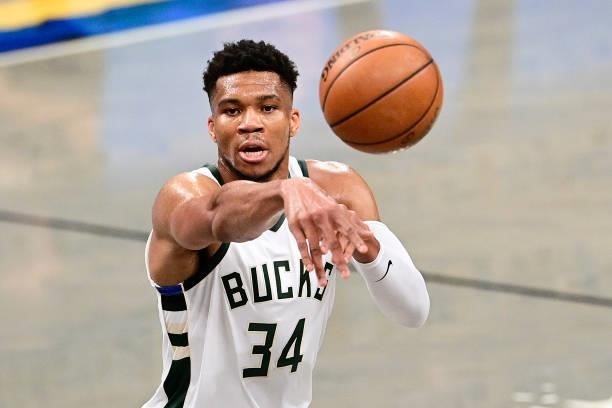 Giannis Antetokounmpo of the Milwaukee Bucks passes the ball against the Brooklyn Nets in Game Two of the Second Round of the 2021 NBA Playoffs at...