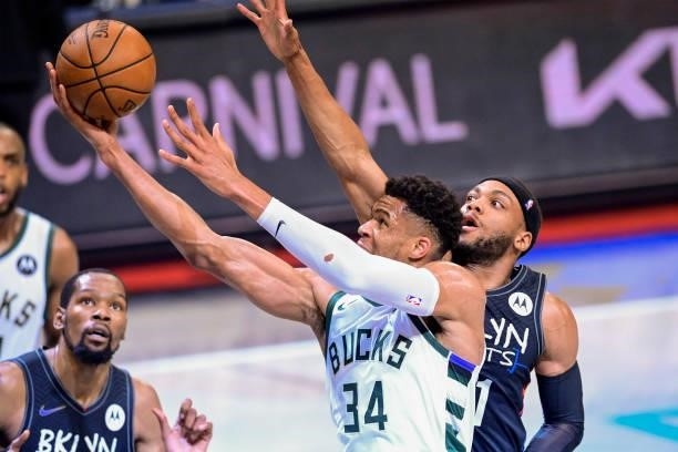 Giannis Antetokounmpo of the Milwaukee Bucks attempts a lay up against the Brooklyn Nets in Game Two of the Second Round of the 2021 NBA Playoffs at...