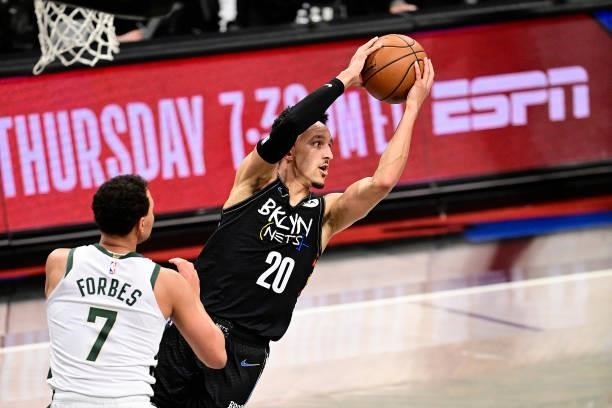 Landry Shamet of the Brooklyn Nets grabs a rebound against the Milwaukee Bucks in Game Two of the Second Round of the 2021 NBA Playoffs at Barclays...