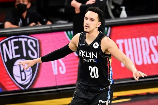 Landry Shamet of the Brooklyn Nets celebrates after scoring a basket against the Milwaukee Bucks in Game Two of the Second Round of the 2021 NBA...