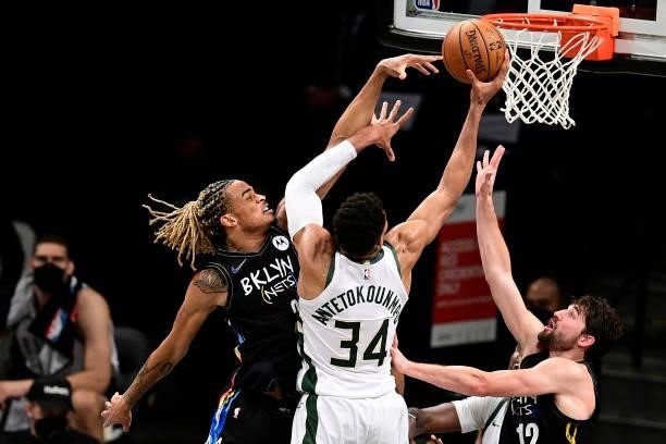 Nicolas Claxton of the Brooklyn Nets defends a shot from Giannis Antetokounmpo of the Milwaukee Bucks in Game Two of the Second Round of the 2021 NBA...