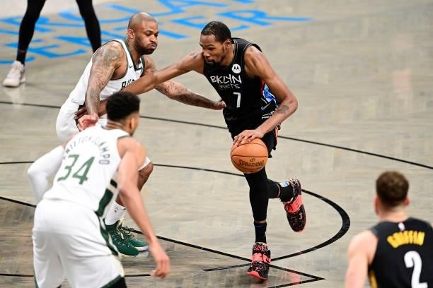 Kevin Durant of the Brooklyn Nets drives to the basket against P.J. Tucker of the Milwaukee Bucks in Game Two of the Second Round of the 2021 NBA...