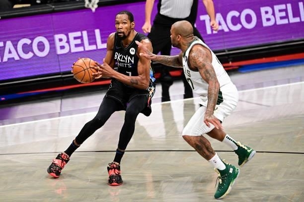 Kevin Durant of the Brooklyn Nets drives to the basket against P.J. Tucker of the Milwaukee Bucks in Game Two of the Second Round of the 2021 NBA...