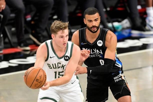 Sam Merrill of the Milwaukee Bucks is defended by Timothe Luwawu-Cabarrot of the Brooklyn Nets in Game Two of the Second Round of the 2021 NBA...