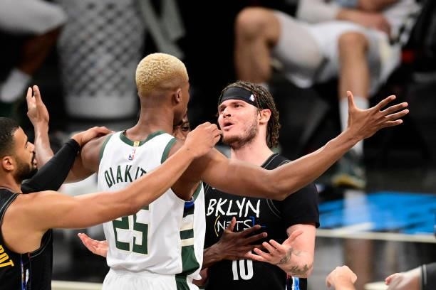 Tyler Johnson of the Brooklyn Nets and Mamadi Diakite of the Milwaukee Bucks exchange words after Diakite is called for a flagrant foul on Johnson in...