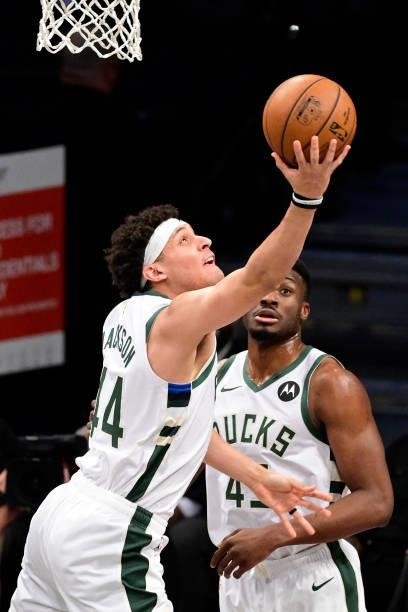 Justin Jackson of the Milwaukee Bucks attempts a lay up against the Brooklyn Nets in Game Two of the Second Round of the 2021 NBA Playoffs at...
