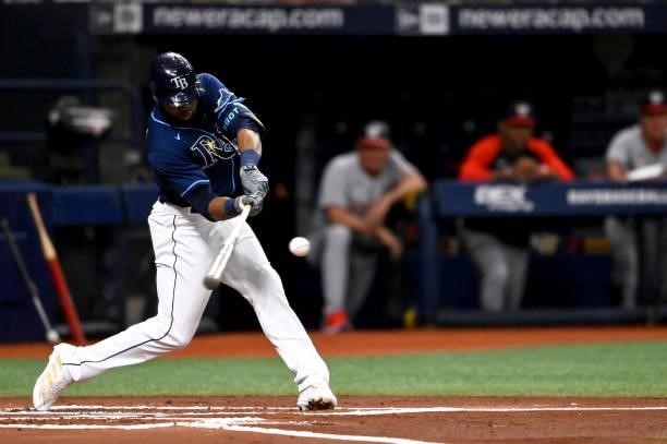 Manuel Margot of the Tampa Bay Rays hits a solo home run during the first inning against the Washington Nationals at Tropicana Field on June 08, 2021...