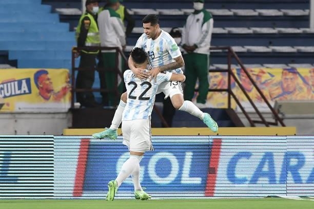 Cristian Romero of Argentina celebrates with Lautaro Martinez of Argentina after scoring the first goal of his team during a match between Colombia...