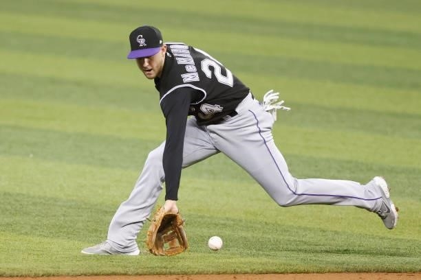 Ryan McMahon of the Colorado Rockies fields a ground ball against the Miami Marlins during the first inning at loanDepot park on June 08, 2021 in...