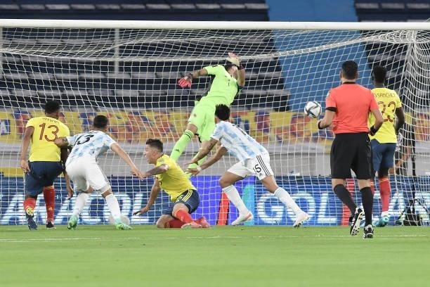 Cristian Romero of Argentina heads to score the first goal of his team during a match between Colombia and Argentina as part of South American...