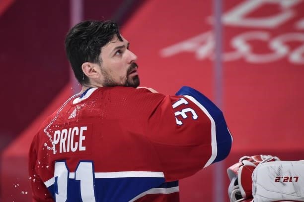 Carey Price of the Montreal Canadiens sprays water on himself prior to the start of the first period against the Winnipeg Jets in Game Four of the...