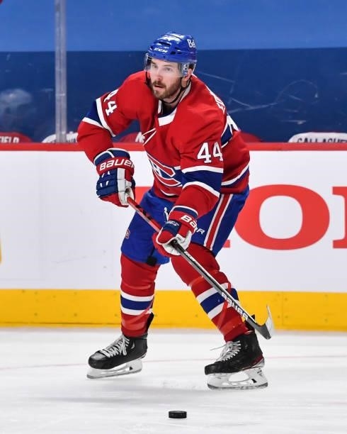 Joel Edmundson of the Montreal Canadiens looks to play the puck against the Winnipeg Jets during the third period in Game Four of the Second Round of...