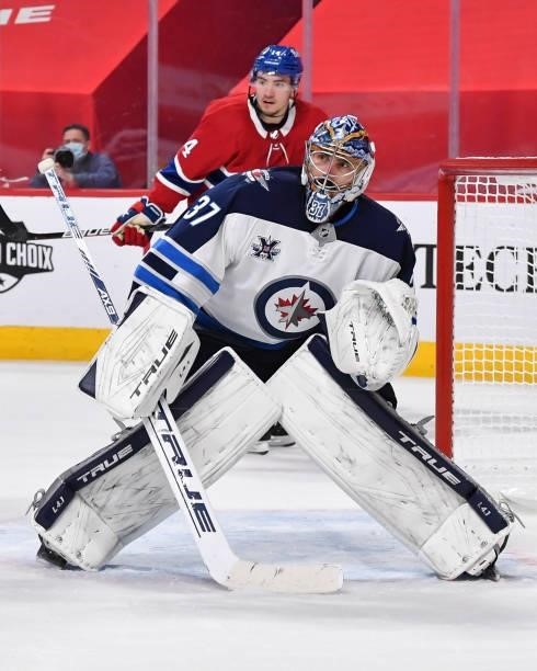 Connor Hellebuyck of the Winnipeg Jets tends goal against the Montreal Canadiens during the second period in Game Four of the Second Round of the...
