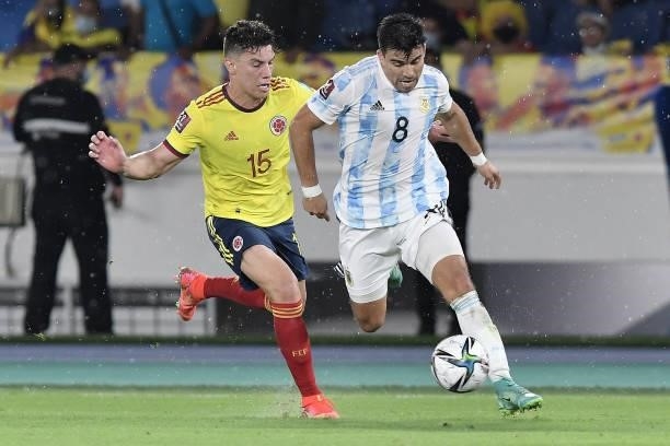 Marcos Acuña of Argentina fights for the ball with Mateus Uribe of Colombia during a match between Colombia and Argentina as part of South American...