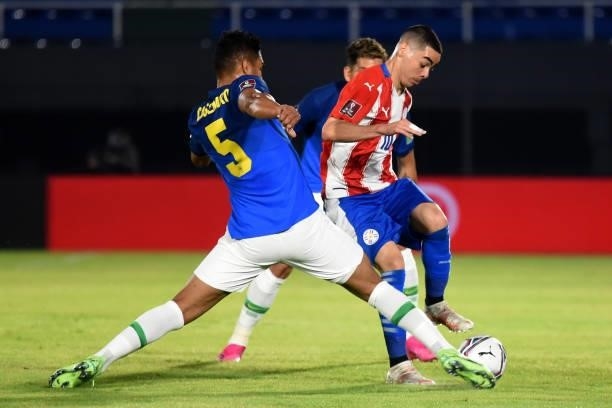 Casemiro of Brazil competes for the ball with Miguel Almirón of Paraguay during a match between Paraguay and Brazil as part of South American...