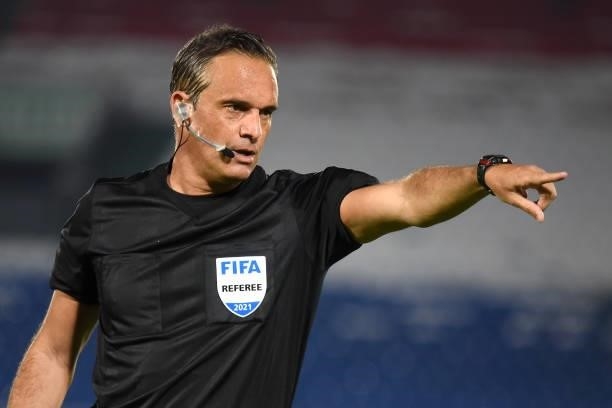 Referee Patricio Loustau gestures during a match between Paraguay and Brazil as part of South American Qualifier for Qatar 2022 at Estadio Defensores...