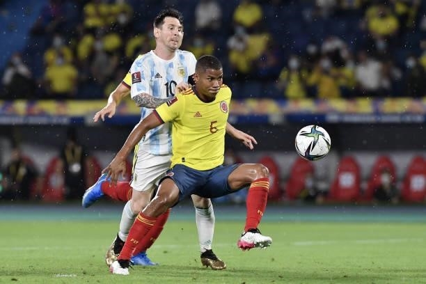 Wilmar Barrios of Colombia fights for the ball with Lionel Messi of Argentina during a match between Colombia and Argentina as part of South American...