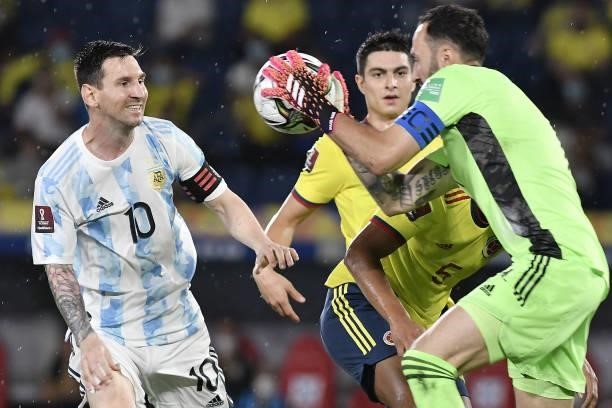David Ospina of Colombia makes a save against Lionel Messi of Argentina during a match between Colombia and Argentina as part of South American...